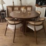 Handcrafted solid wood round dining table for contemporary interiors
