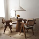 Space saving solid wood round dining table for modern Indian homes